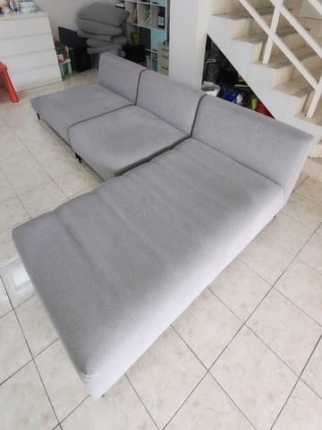 L-shaped sofa by the staircase, after cleaning